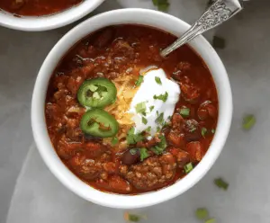 Hearty gluten-free chili topped with fresh herbs in a bowl, perfect for a warm, healthy meal