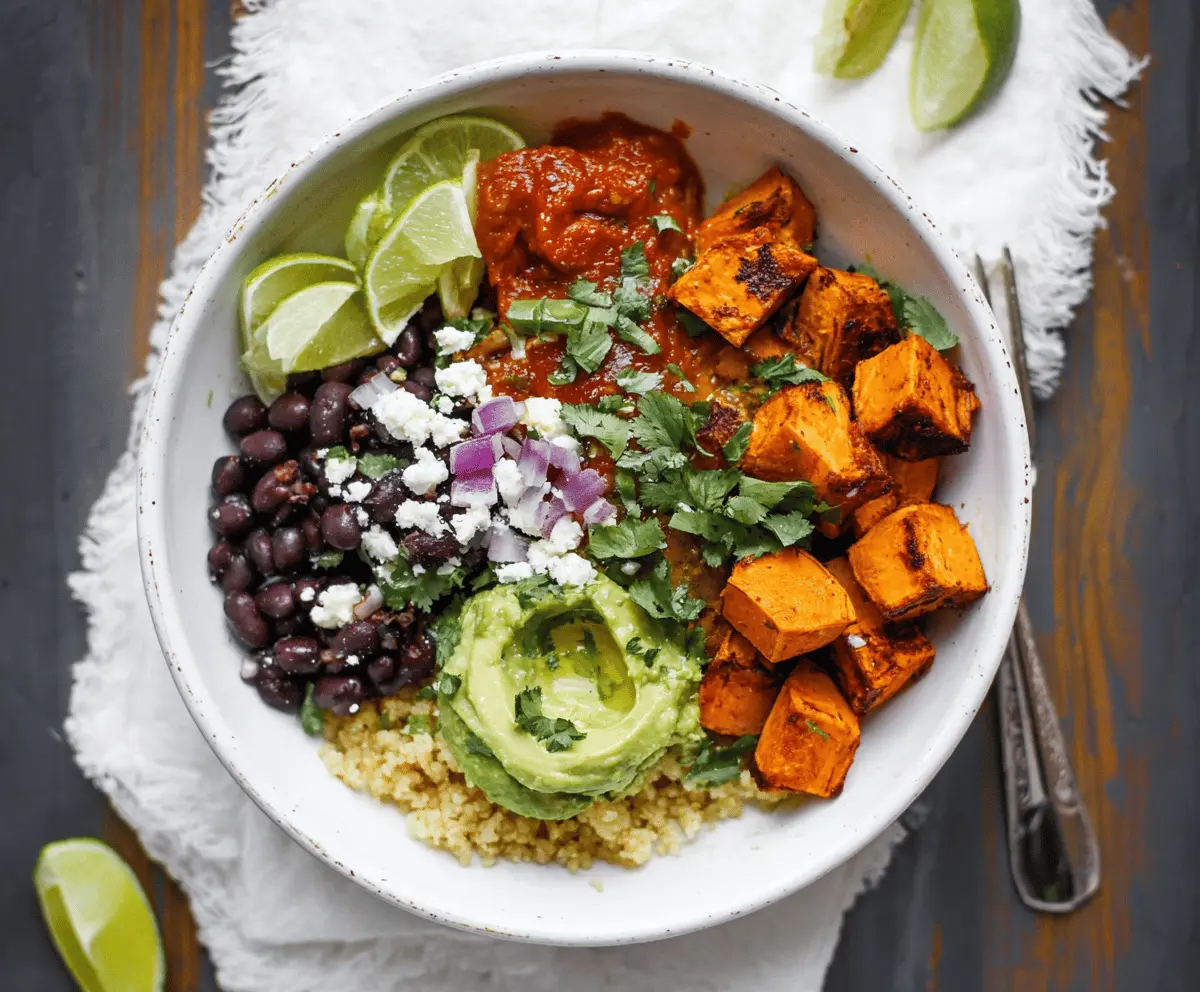 Delicious Chipotle Sweet Potato Burrito Bowls with roasted sweet potatoes, black beans, rice, avocado, and fresh cilantro in a bowl.