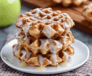 Delicious apple fritter waffle donuts topped with cinnamon sugar glaze