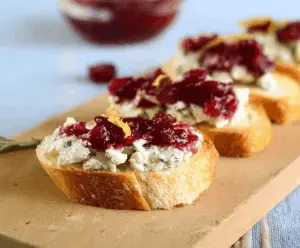 Delicious Blue Cheese Cranberry Crostini served on a platter, capturing the appetizer's creamy cheese and tart cranberries.