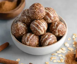 Delicious Cinnamon Roll Energy Bites on a plate, showcasing a quick and healthy snack option.