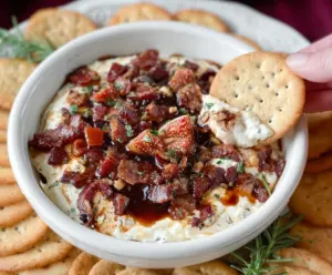 Delicious Fig and Bacon Boursin Cheese Dip served with crackers, perfect for appetizer.