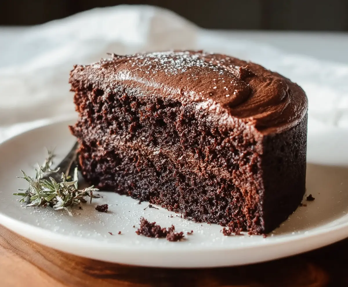 Delicious sourdough discard chocolate cake sliced and ready to serve, showcasing rich chocolate layers.