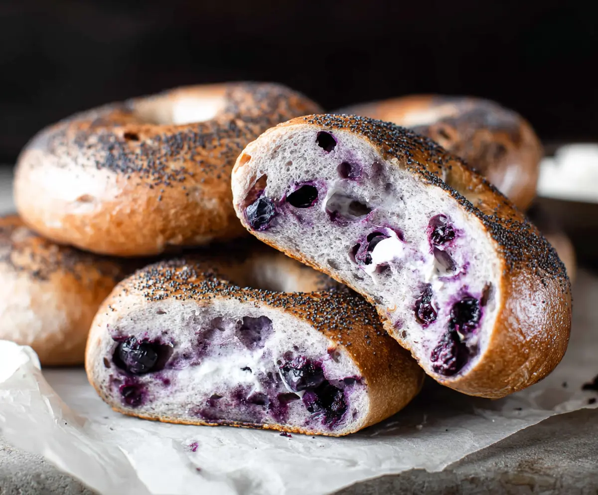 Delicious homemade blueberry bagels with fresh blueberries and a golden crust.