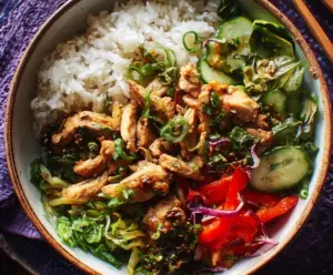 Delicious Ginger and Scallion Chicken Bowl served with fresh vegetables.