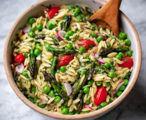 Colorful Spring Orzo Pasta Salad with fresh vegetables and herbs